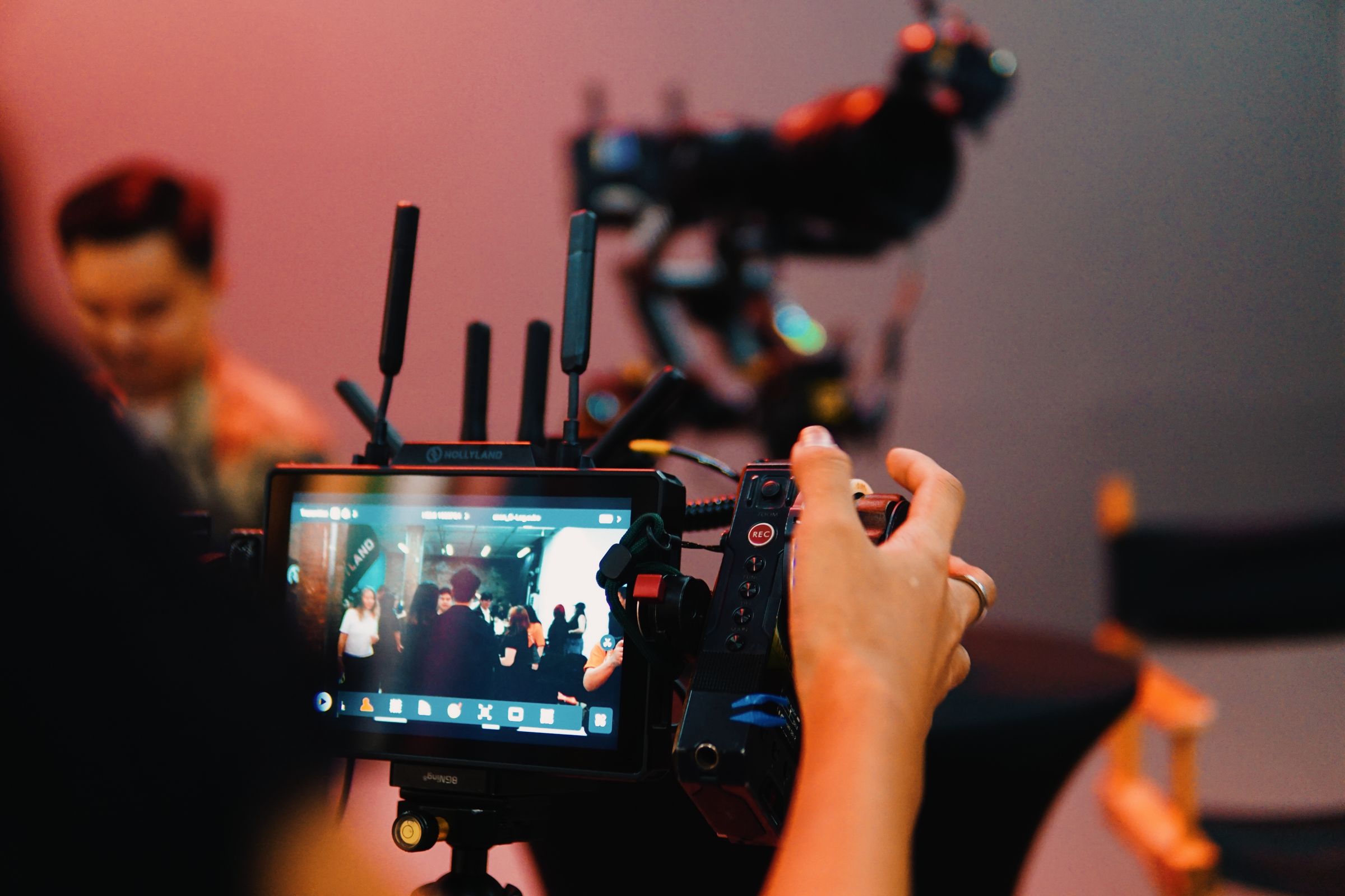 A director reviewing a filmed performance on a production monitor
